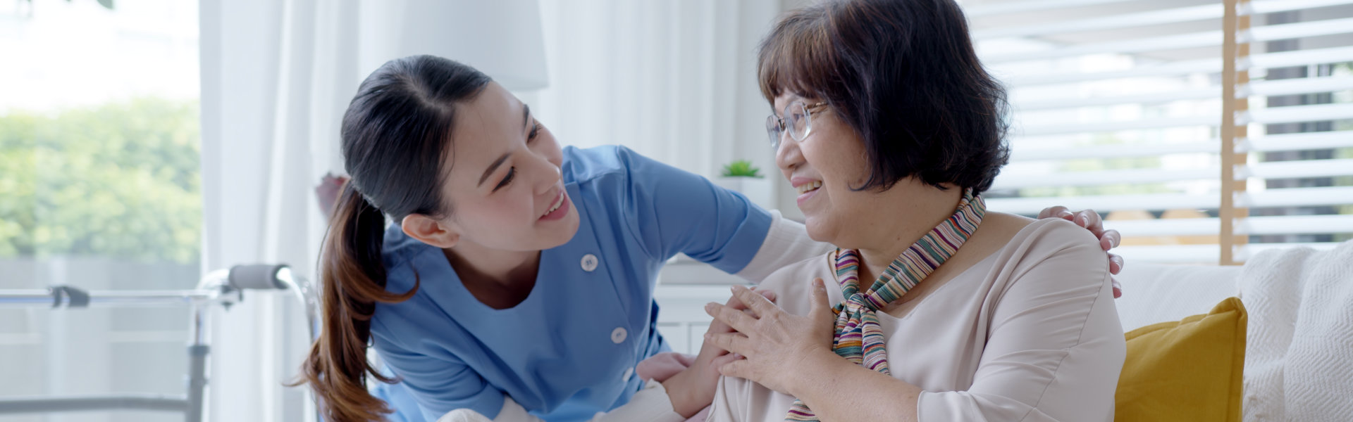 caregiver talking to senior woman